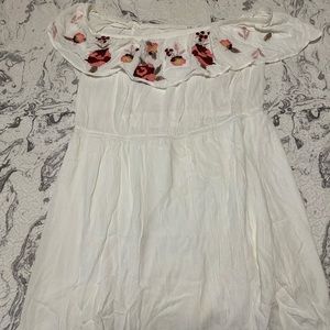 White dress with floral accent